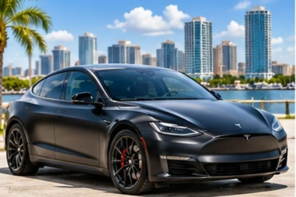 Matte gray wrapped Tesla sedan by the Los Angeles waterfront